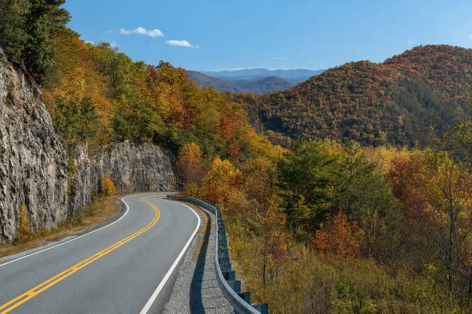A mountain road winding through fall color in the Blue Ridge near Helen, Georgia
