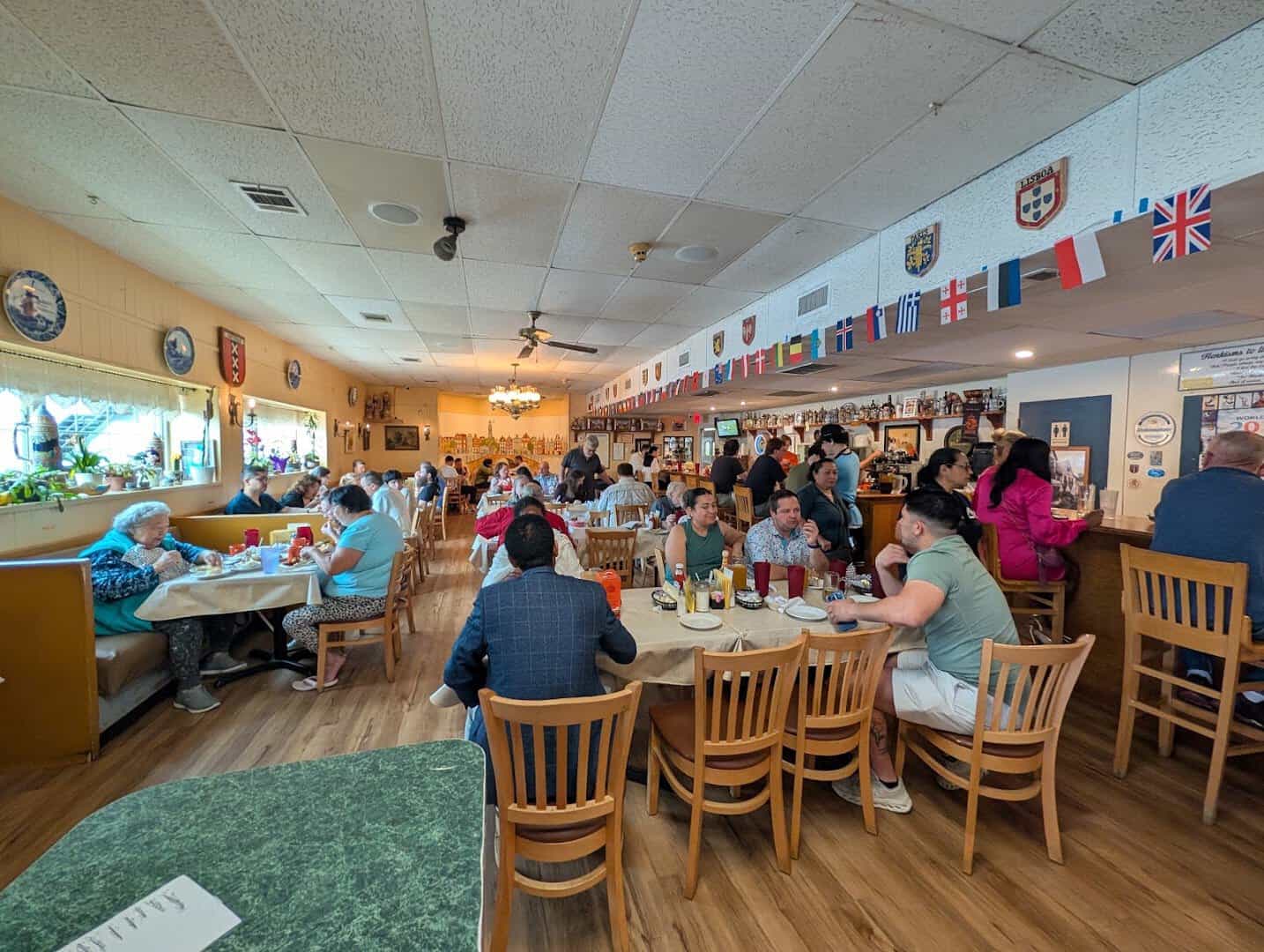 Dining room with European flags at Henk's European Deli in Dallas