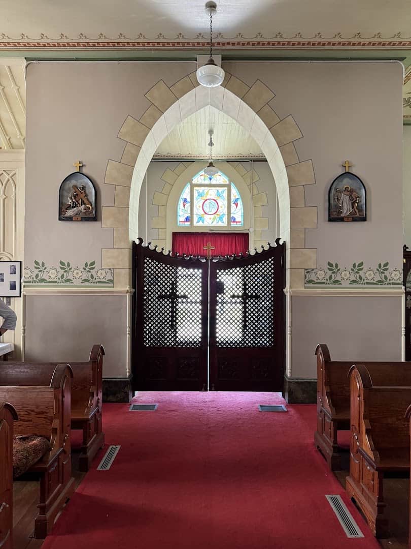 Faux-marble painted archway and blue stenciling near the entrance of the High Hill church