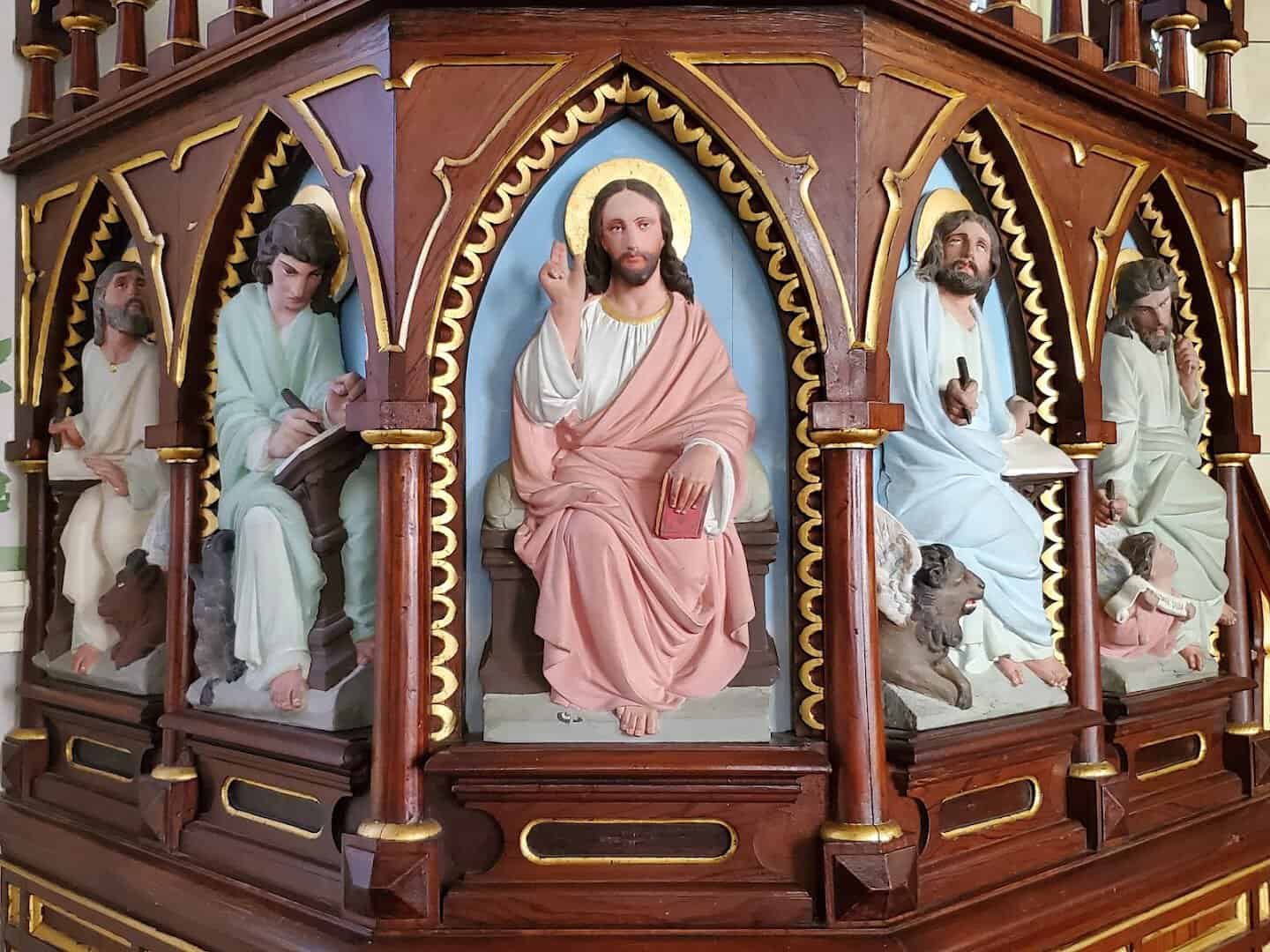 Gilded carved altar relief of Christ and the evangelists at St. Mary's Catholic Church in High Hill, Texas