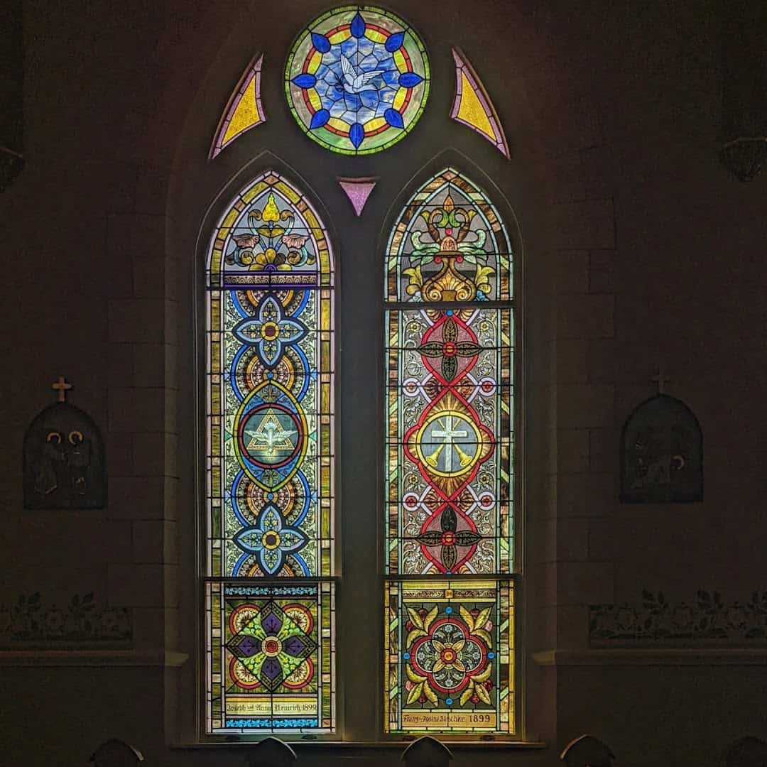 Rose and lancet stained glass windows at St. Mary's Catholic Church in High Hill, Texas