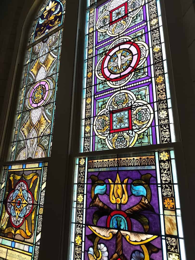 Colorful stained glass lancet windows at St. Mary's Catholic Church in High Hill, Texas