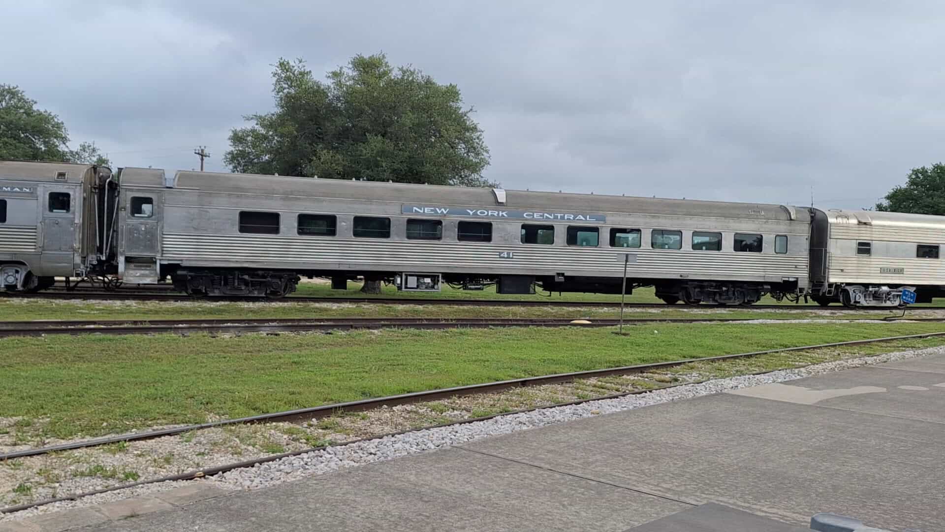 Silver passenger coaches of the Hill Country Flyer excursion train near Cedar Park, Texas