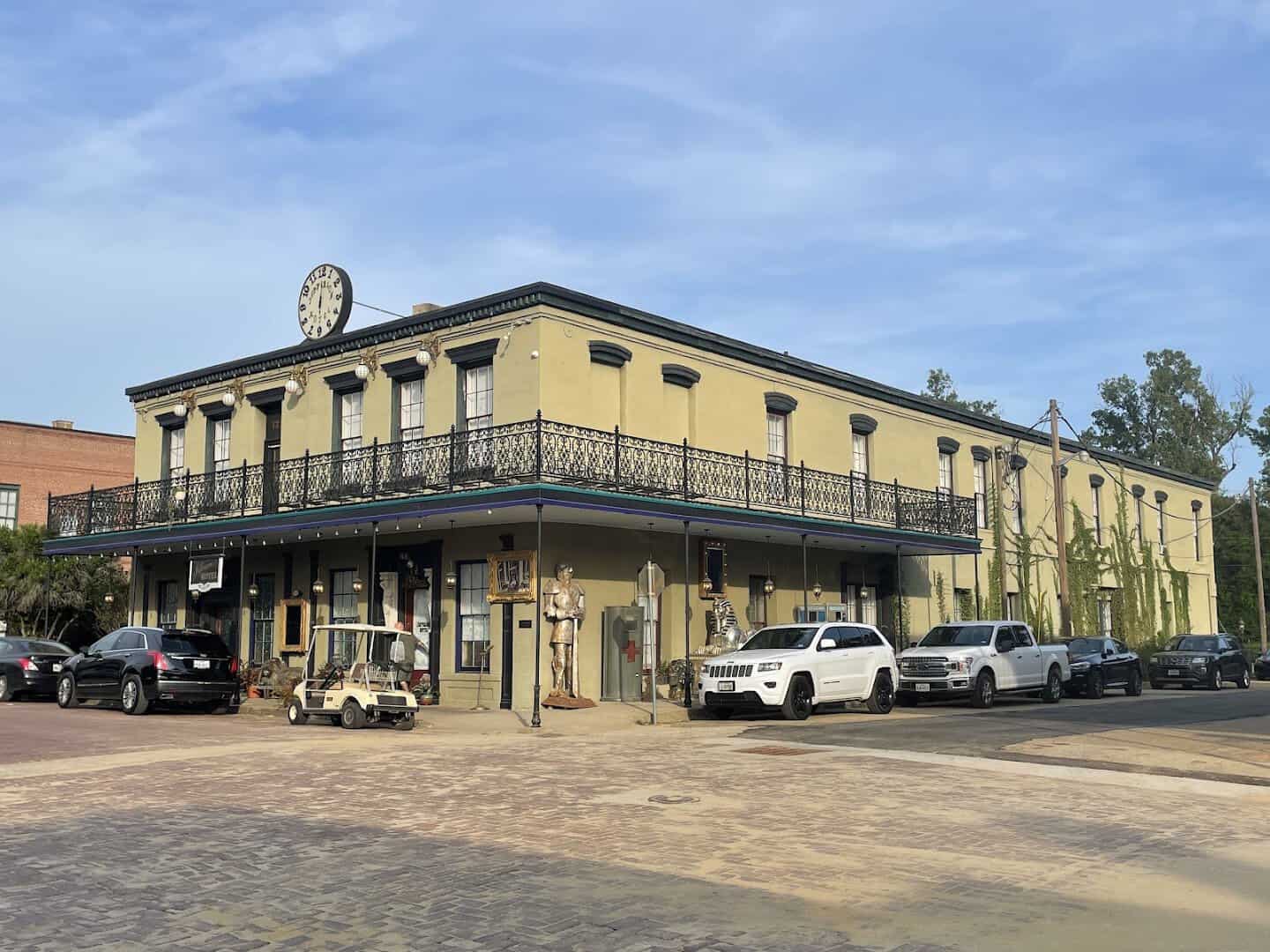 The Historic Jefferson Hotel brick building with a balcony in Jefferson, Texas