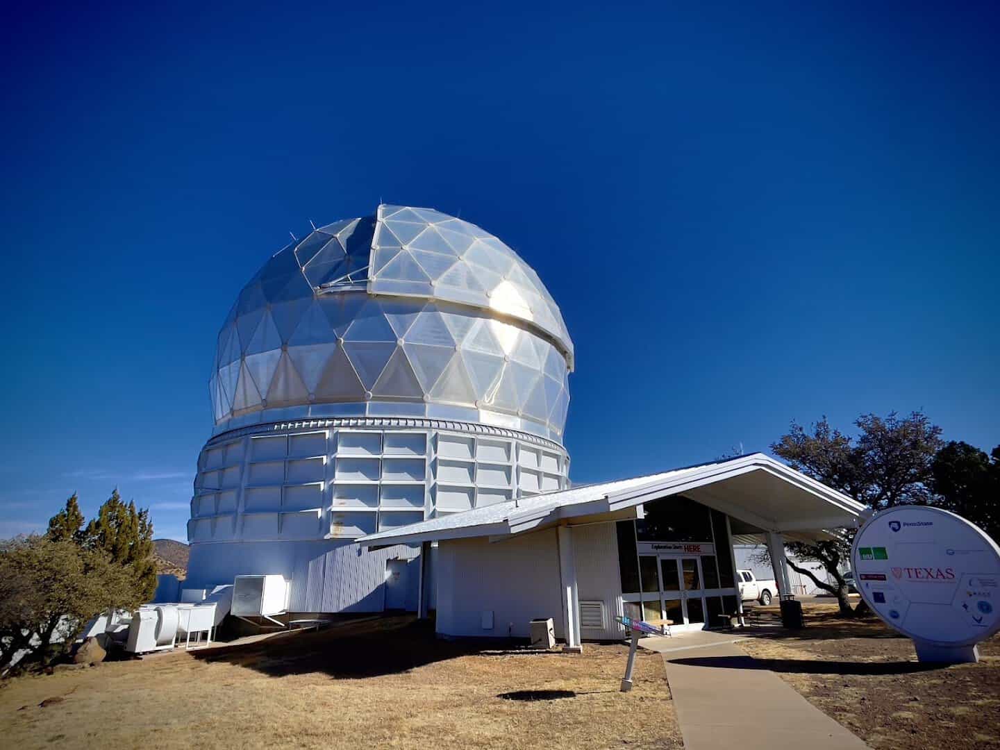 The Hobby-Eberly Telescope dome under blue sky at McDonald Observatory, Texas