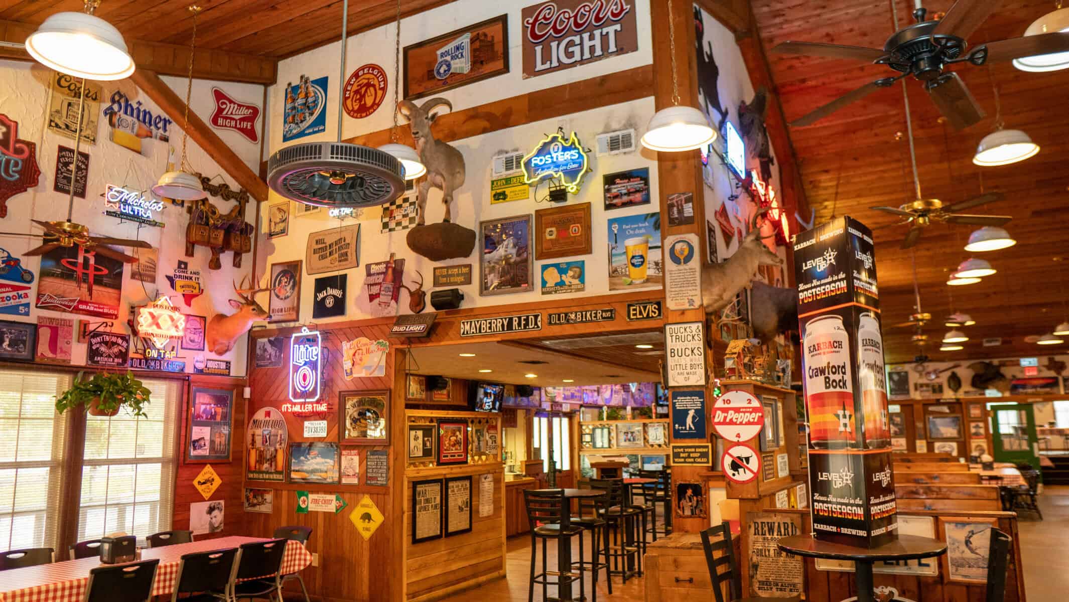 Bar corner covered in Texas memorabilia at Hofbrau Steaks in Porter, Texas