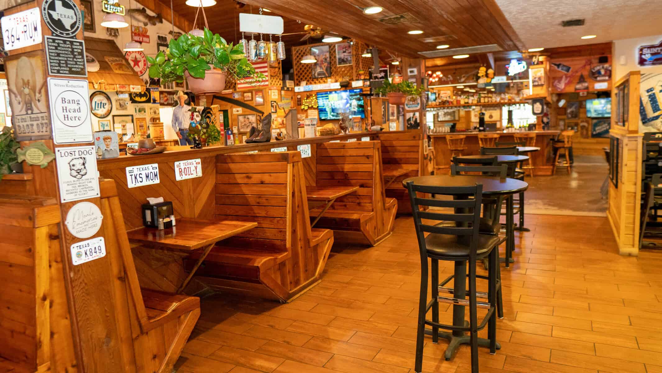 Wood-panelled dining room and bar at Hofbrau Steaks in Porter, Texas