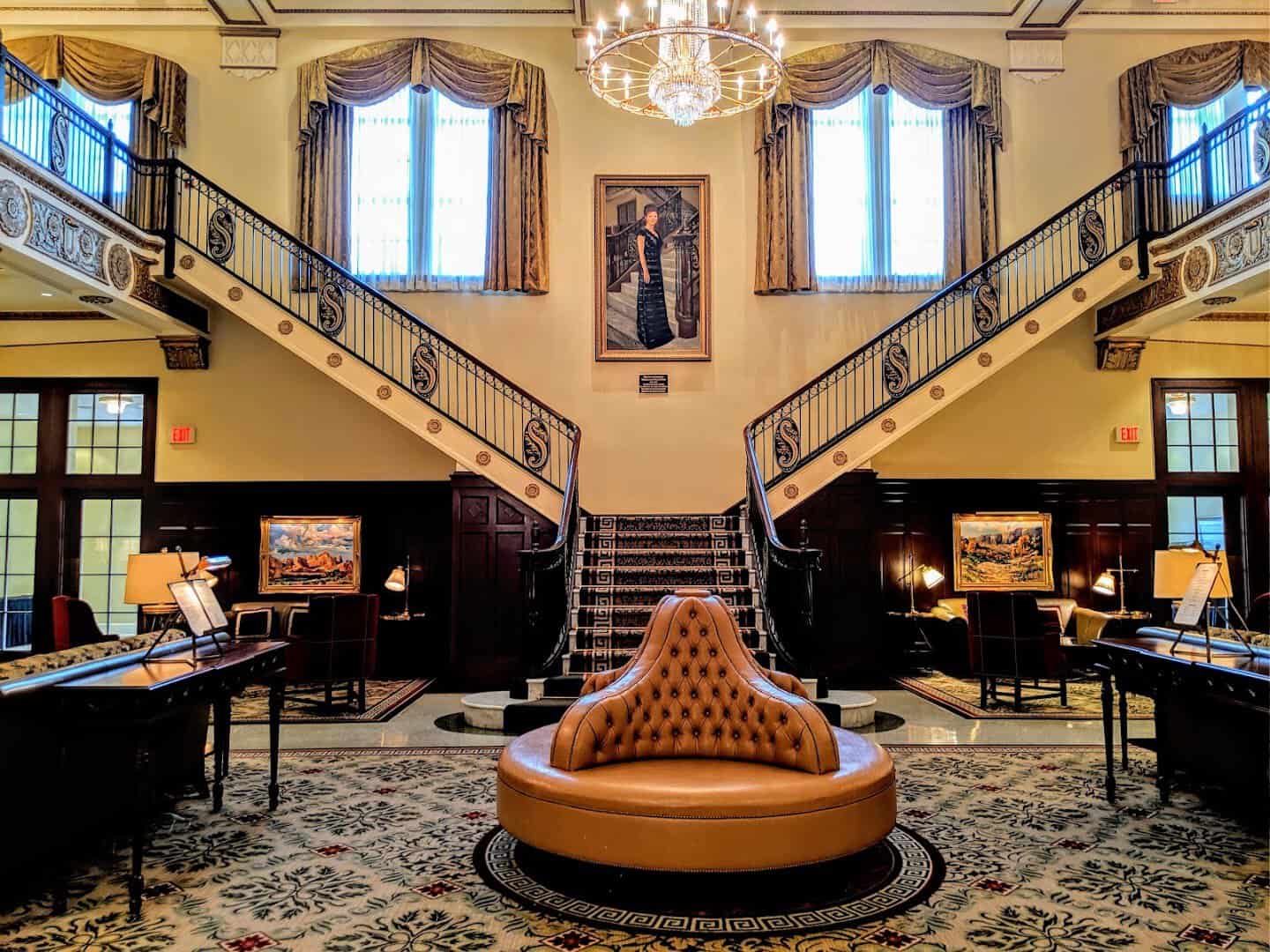 The grand marble staircase and chandelier in the lobby of Hotel Settles in Big Spring, Texas