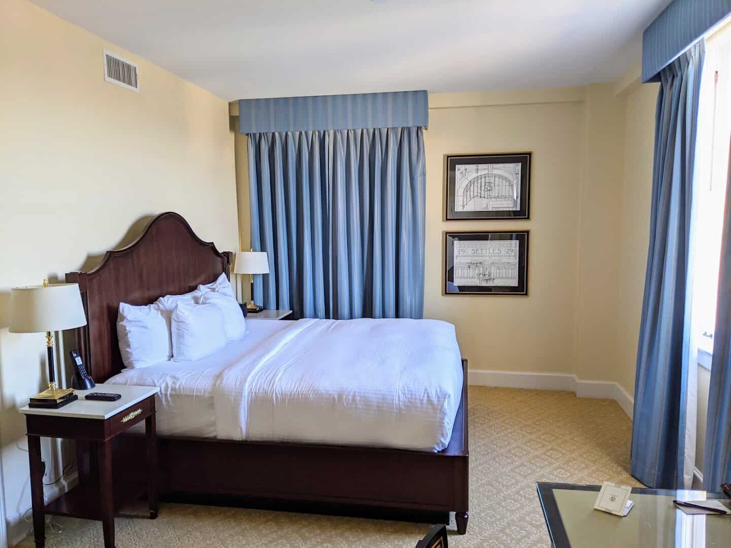 Spacious guest room with a king bed at Hotel Settles