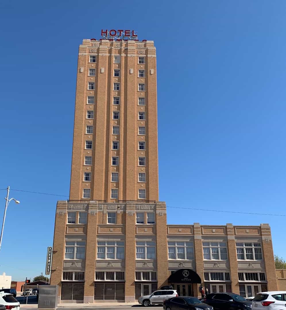 The Art Deco Hotel Settles tower rising over downtown Big Spring, Texas by day