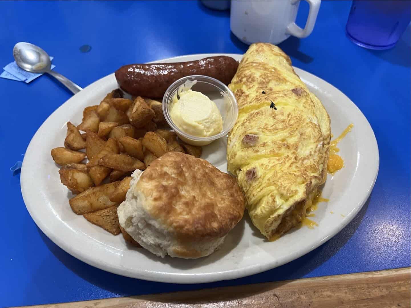 Omelet with biscuits, breakfast potatoes, and sausage at Humble City Cafe in Humble