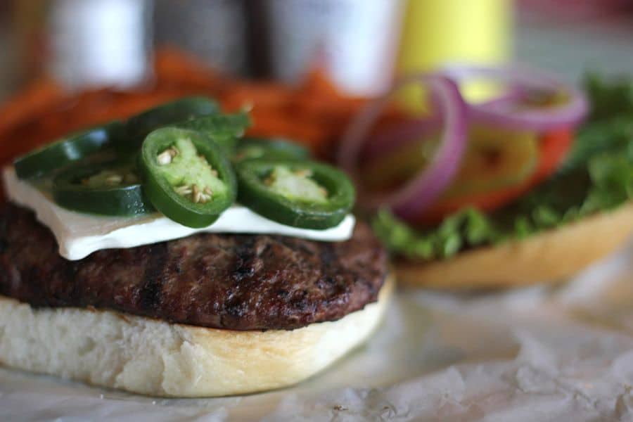 Jalapeno cream cheese burger with fresh jalapenos at Roadhouse in Bastrop, Texas