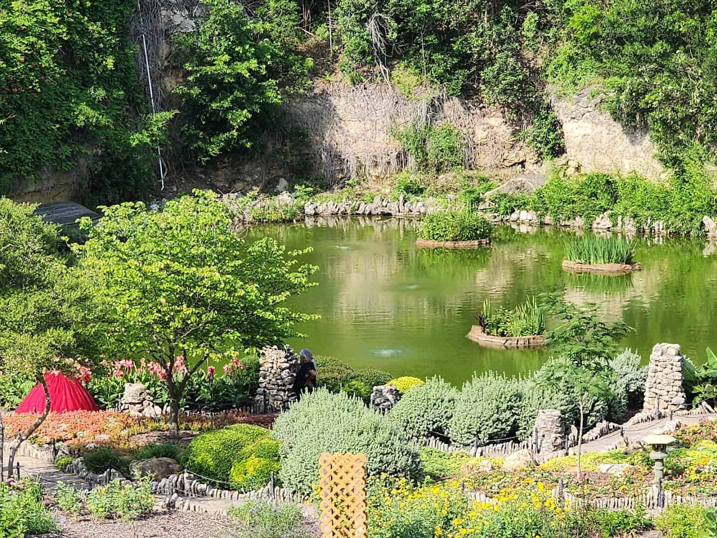 Sweeping view of the sunken garden and quarry pond at the Japanese Tea Garden in San Antonio