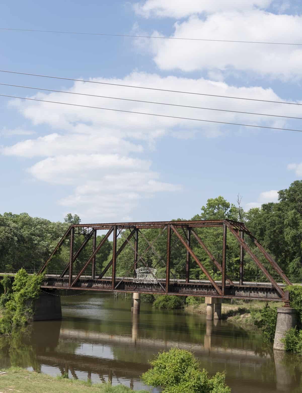 Historic iron railroad bridge over Big Cypress Bayou in Jefferson, Texas