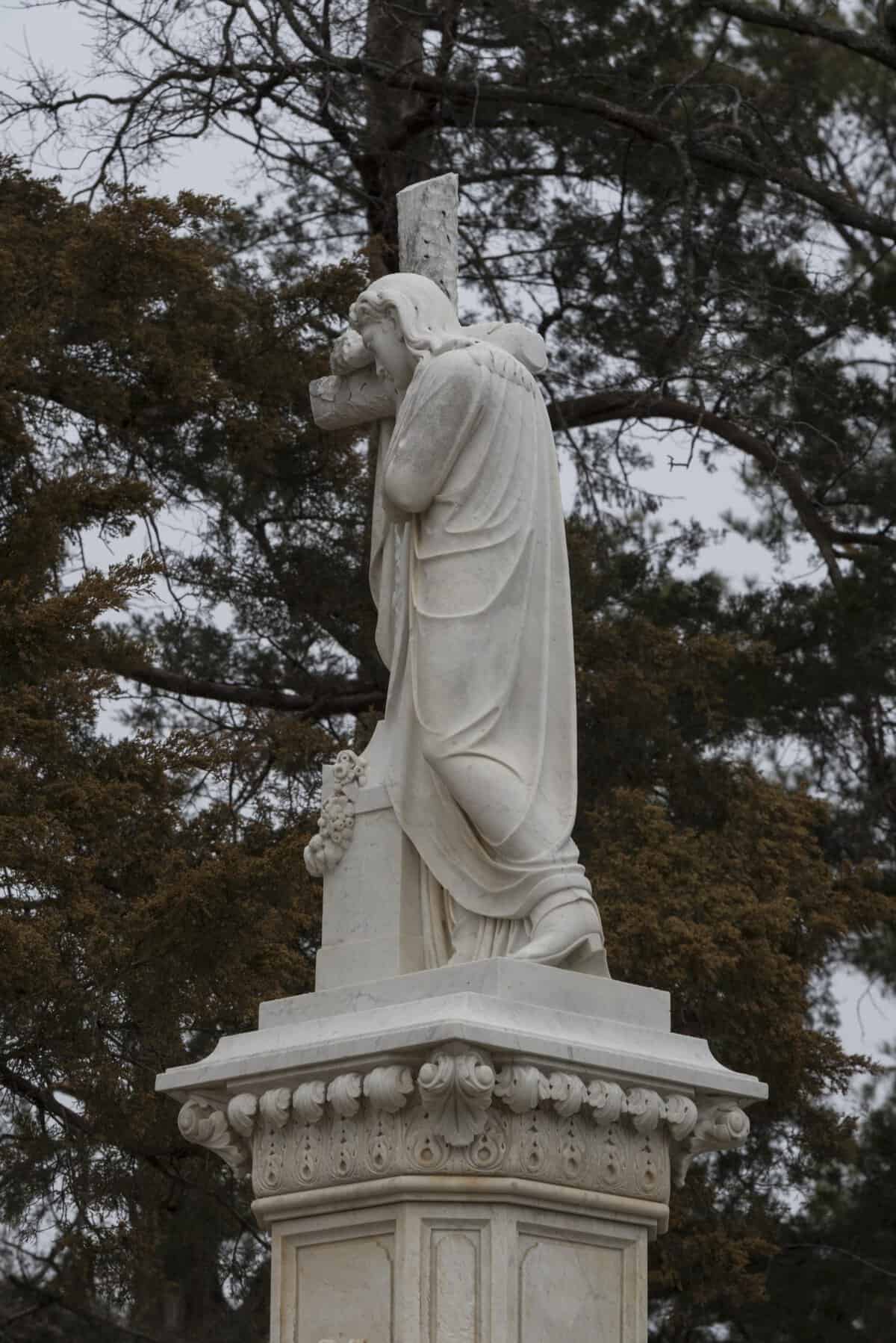 The Jesus in cowboy boots statue on Willet Babcock's grave in Paris, Texas