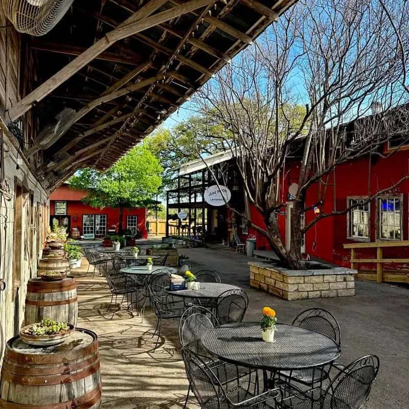 Shops and cafe tables in a downtown courtyard in Johnson City, Texas