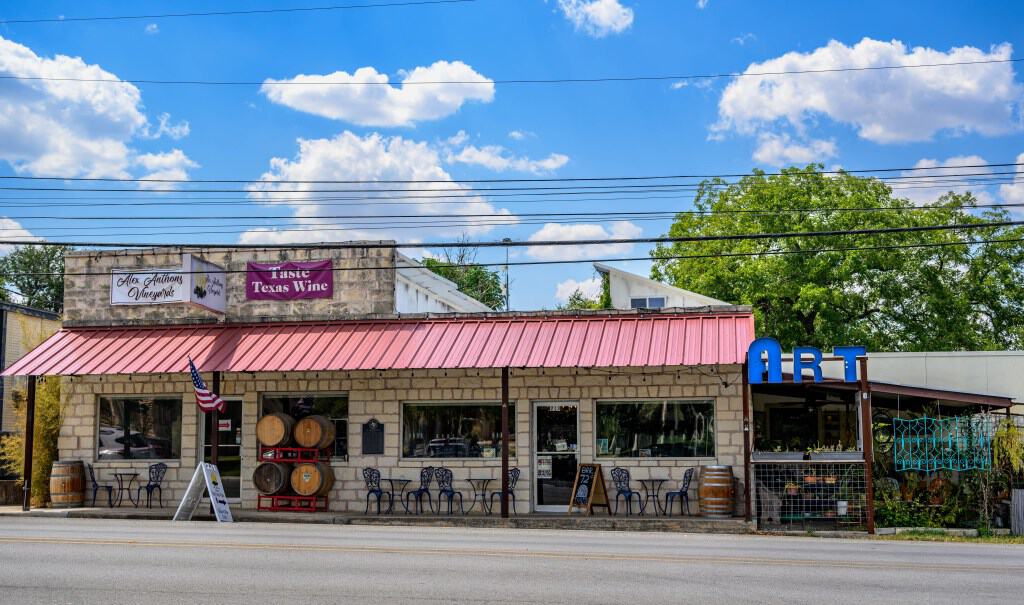 A Taste Texas Wine tasting room storefront on Wine Road 290 in Johnson City, Texas