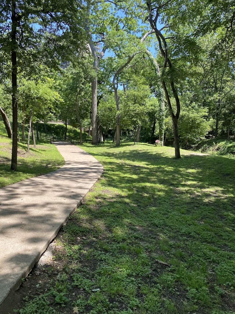 The tree-shaded paved Katy Trail winding through Uptown Dallas, Texas