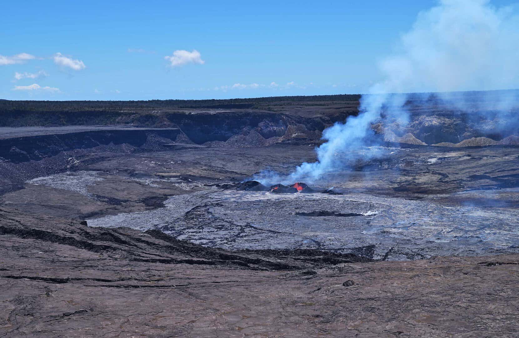 Red volcanic glow and fume rising from Halemaumau Crater, Kilauea Hawaii