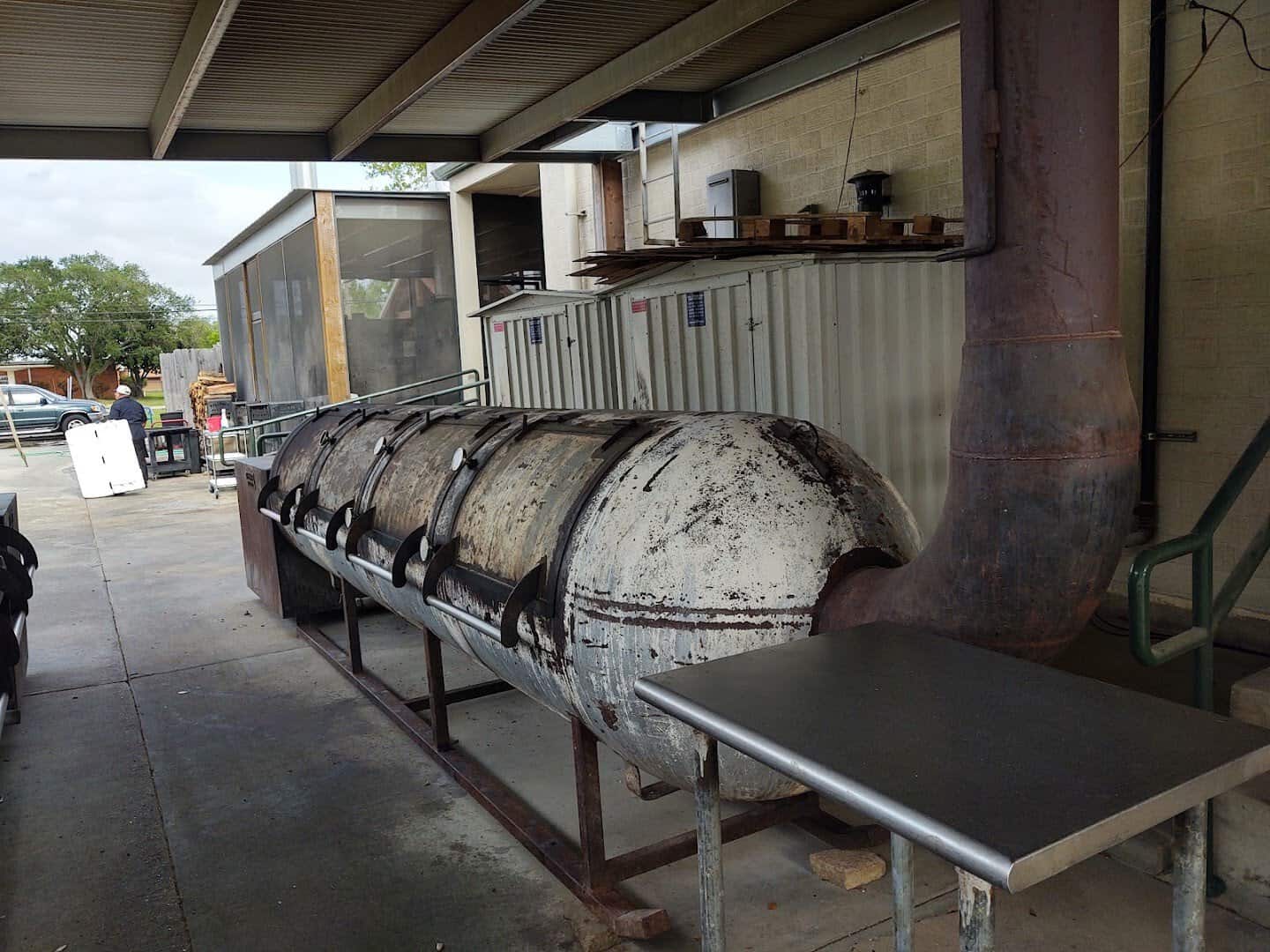 The large Oyler rotisserie smoker behind Killen's Barbecue in Pearland, Texas