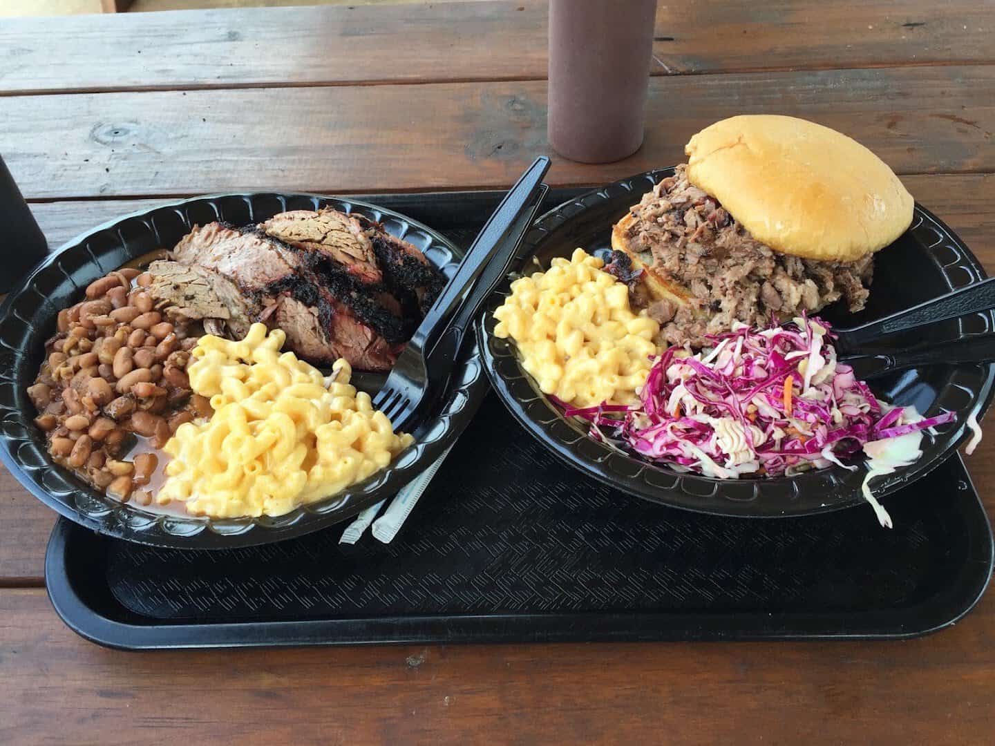 Barbecue trays with mac and cheese, beans and coleslaw at Killen's Barbecue in Pearland, Texas