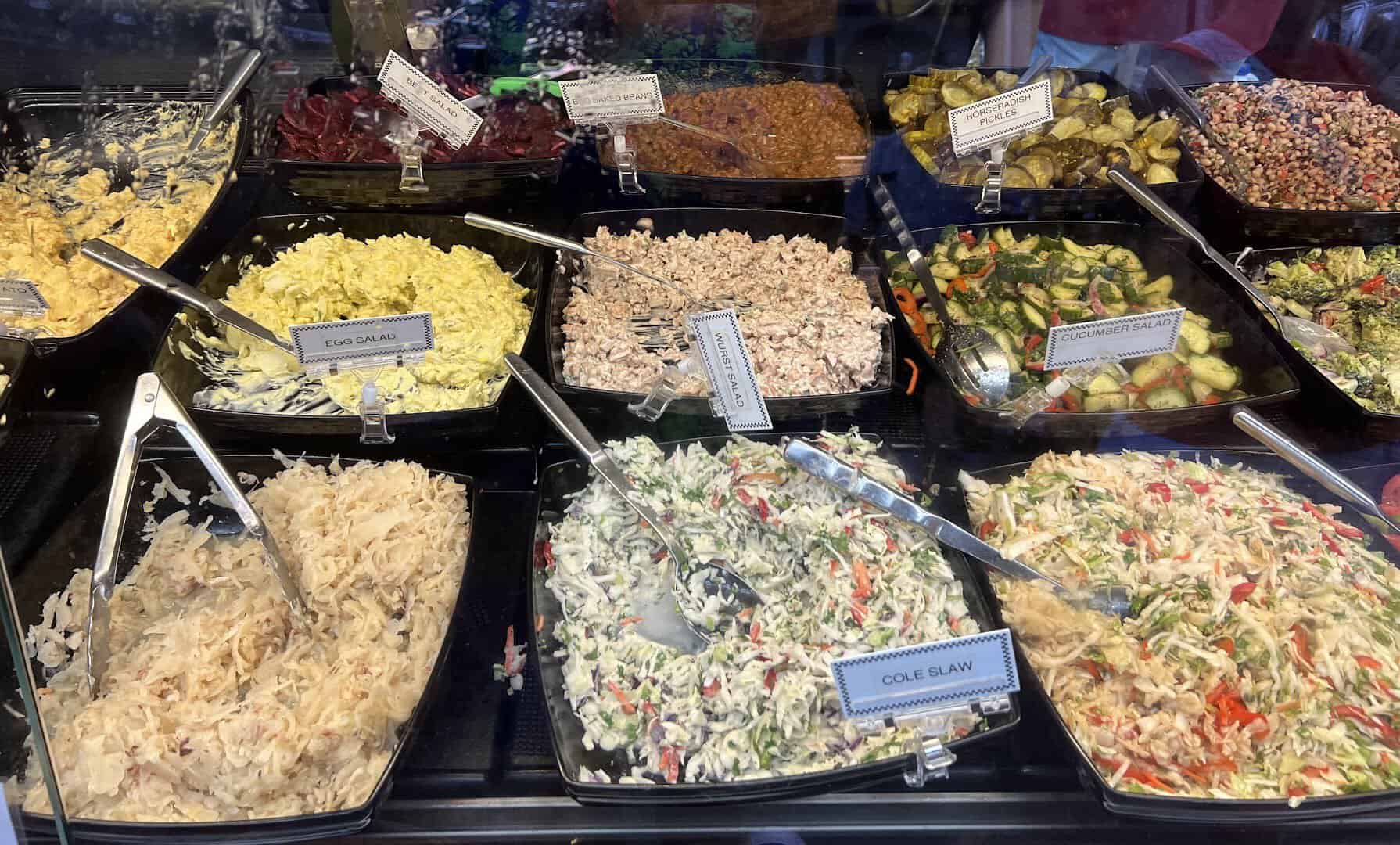 Trays of German potato salad, sauerkraut and sides at Kuby's in Dallas