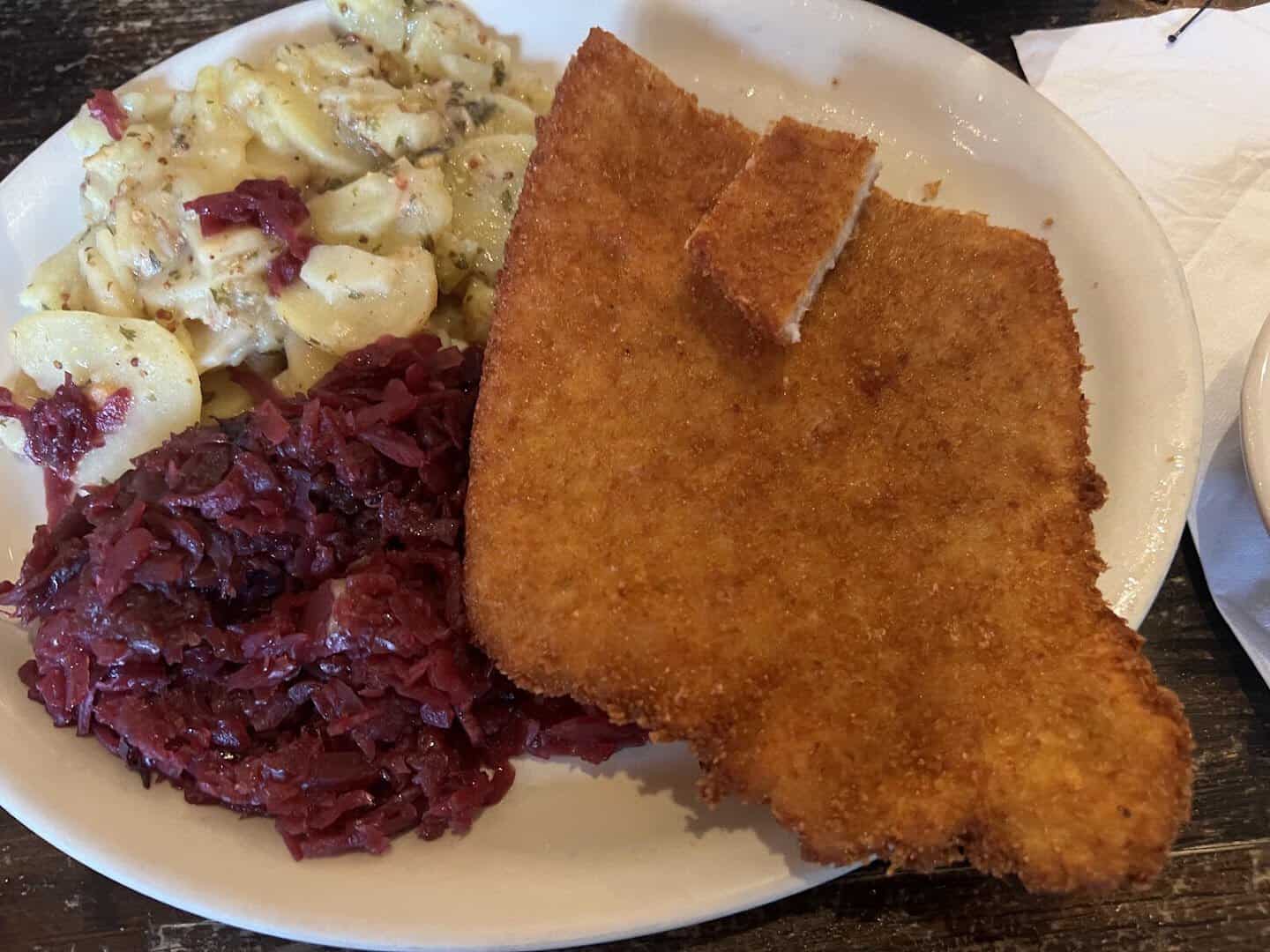Golden schnitzel with red cabbage and German potato salad at Kuby's in Dallas