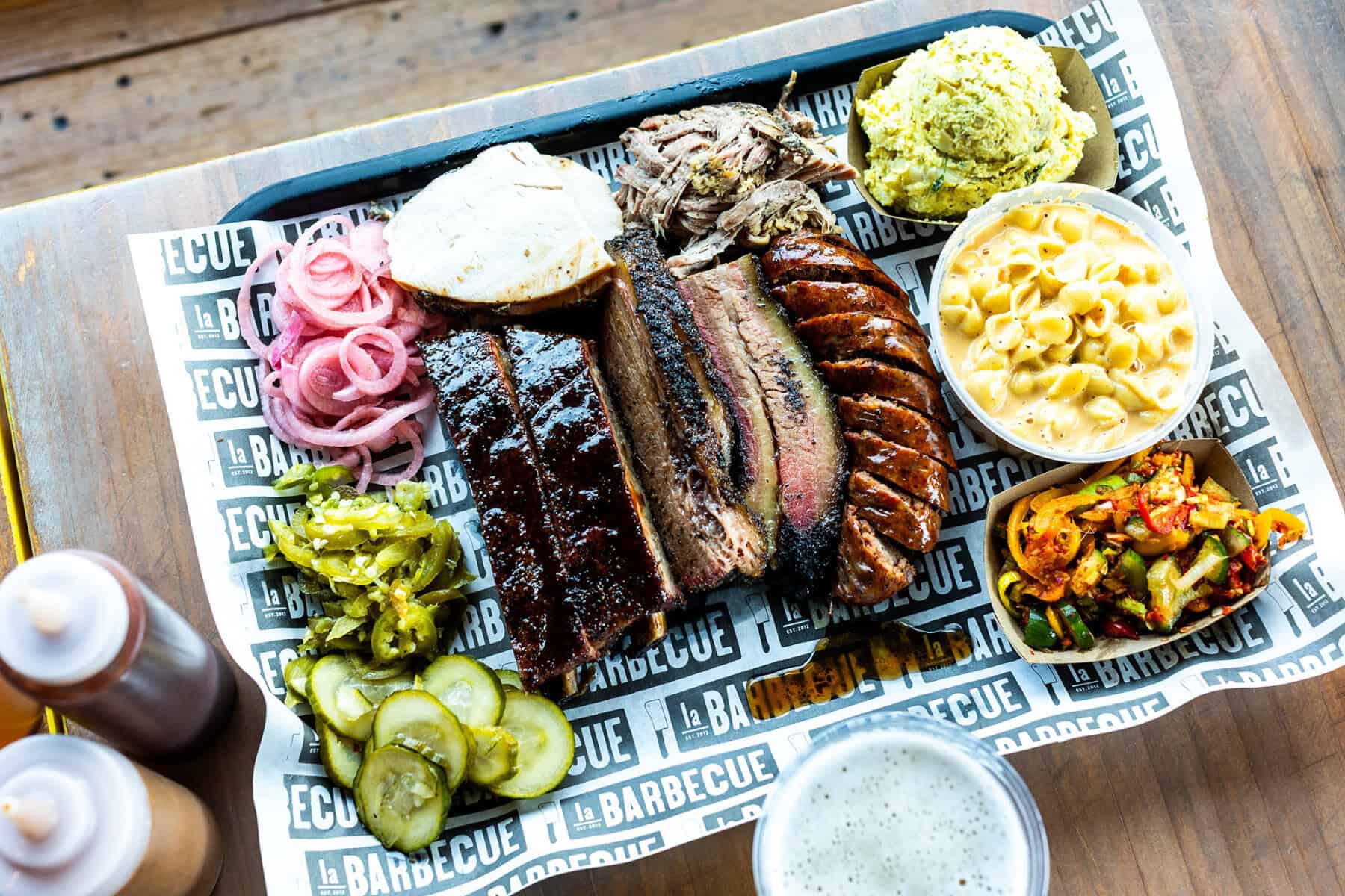 Plate of brisket, sausage and sides at la Barbecue in Austin, Texas