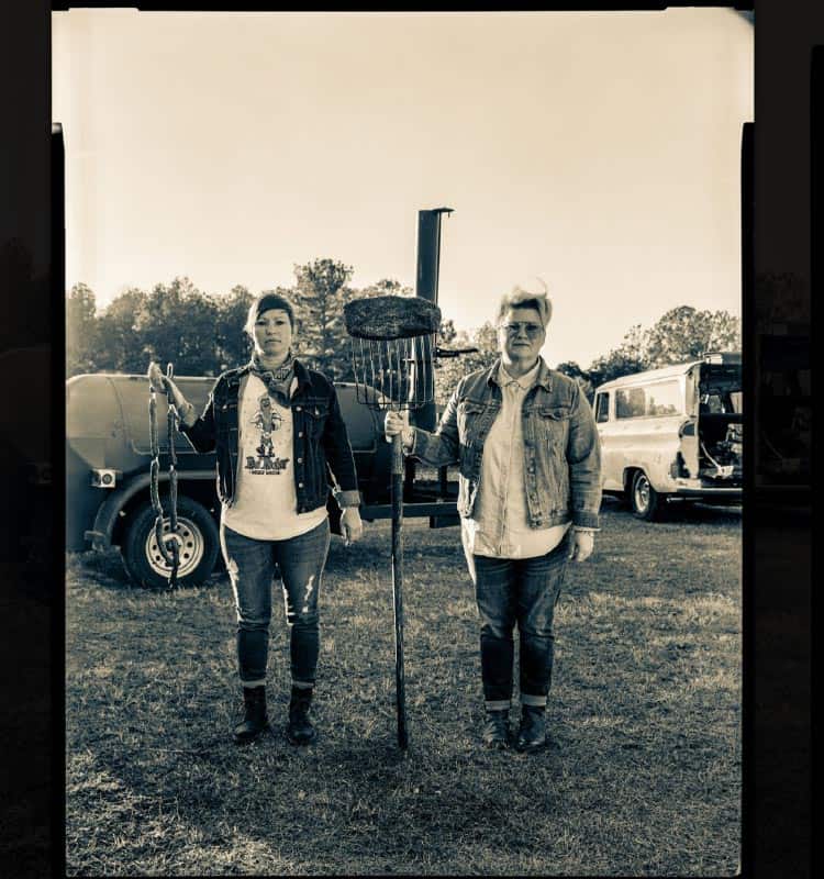 Founders of la Barbecue beside the smoker trailer in Austin, Texas