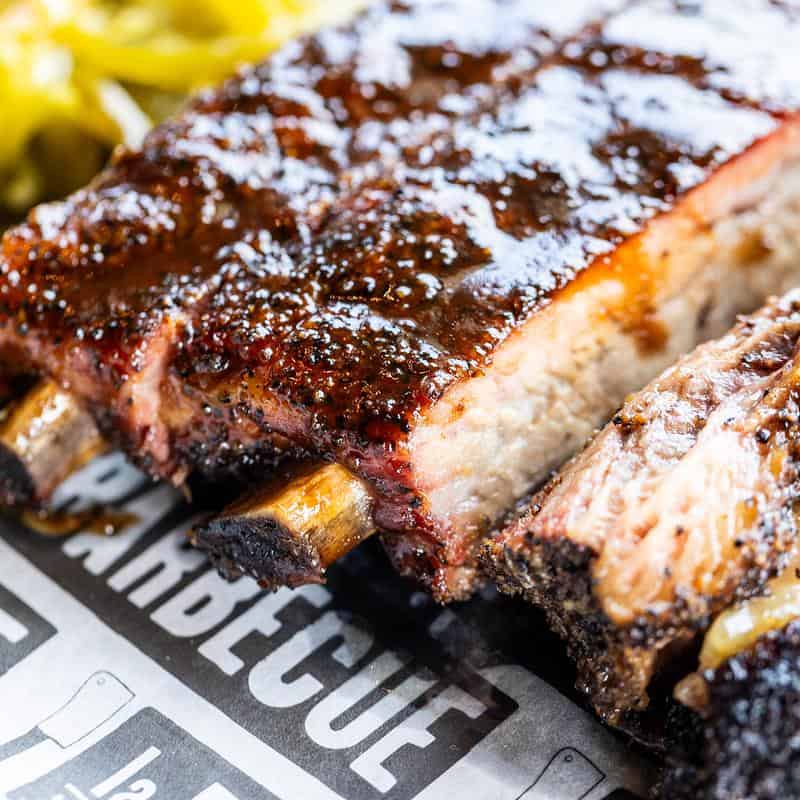 Glazed smoked pork ribs at la Barbecue in Austin, Texas