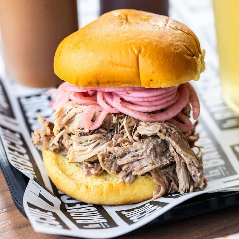 Pulled pork sandwich on branded paper at la Barbecue in Austin, Texas