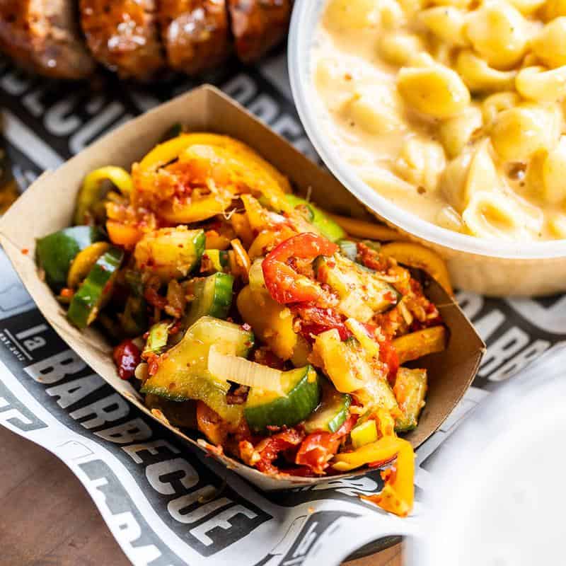 House-made sausage links and sides at la Barbecue in Austin, Texas