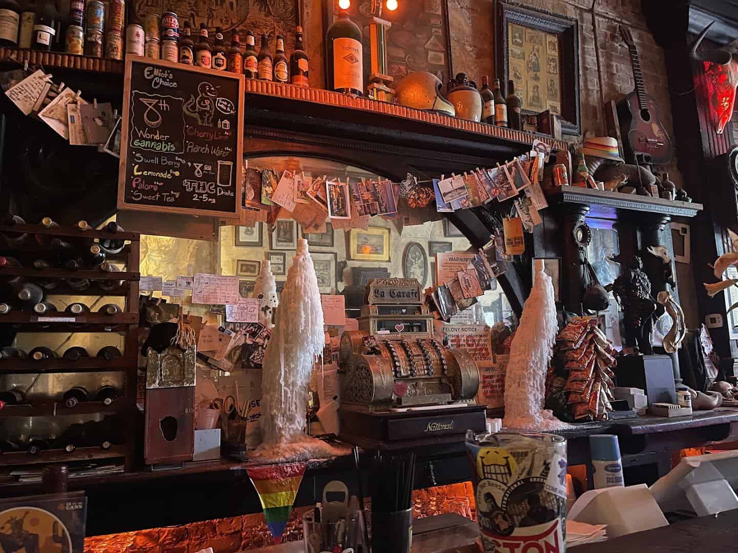 Warm candlelit interior and bar at La Carafe in Houston