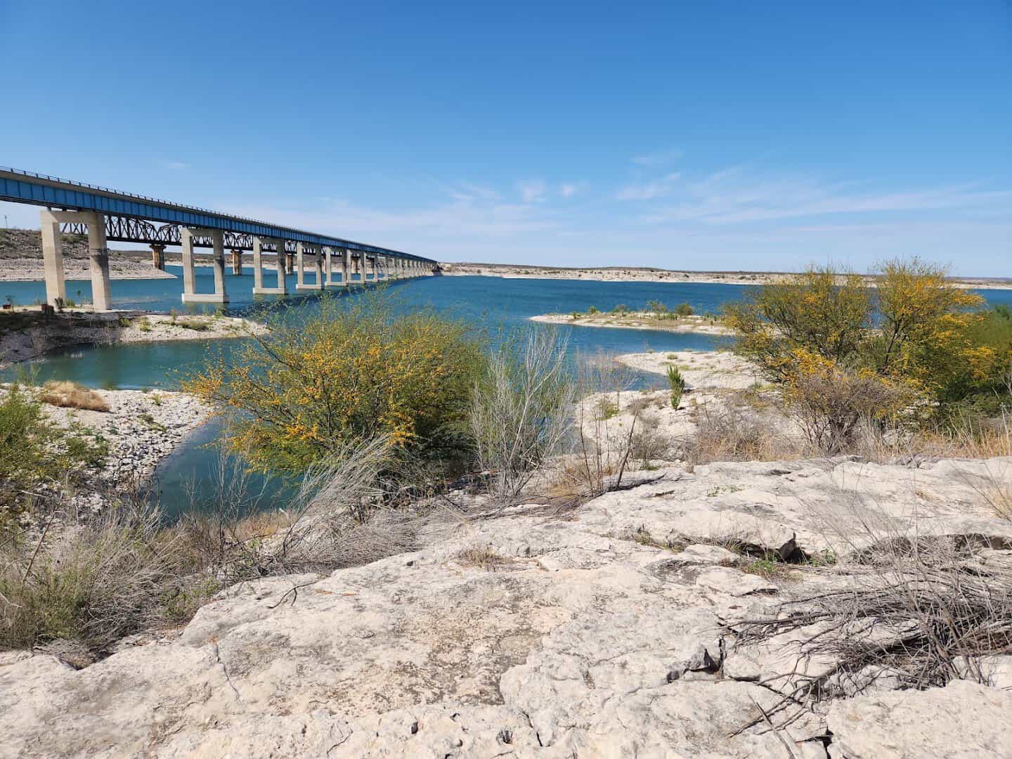 The Highway 90 bridge crossing the blue water of Lake Amistad, Texas