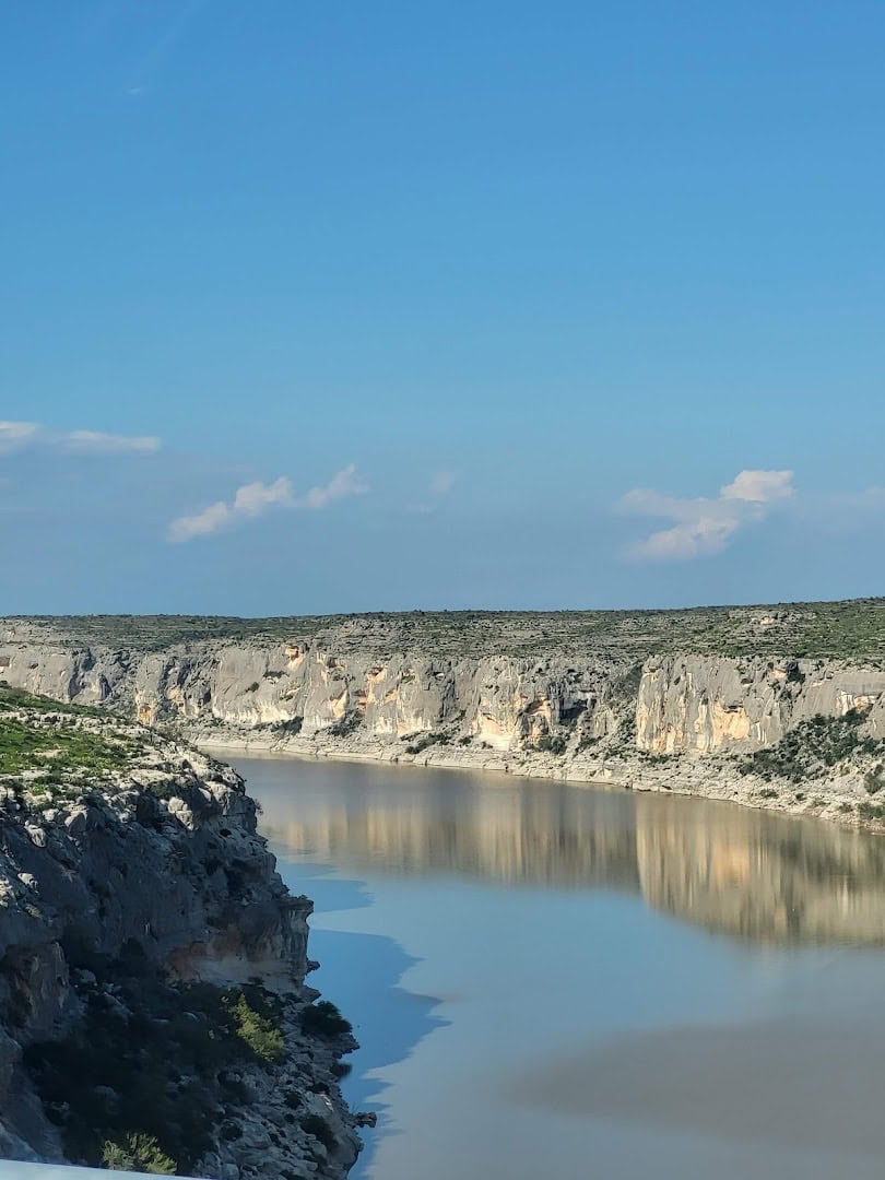 Steep limestone canyon walls along the Pecos River arm of Lake Amistad, Texas