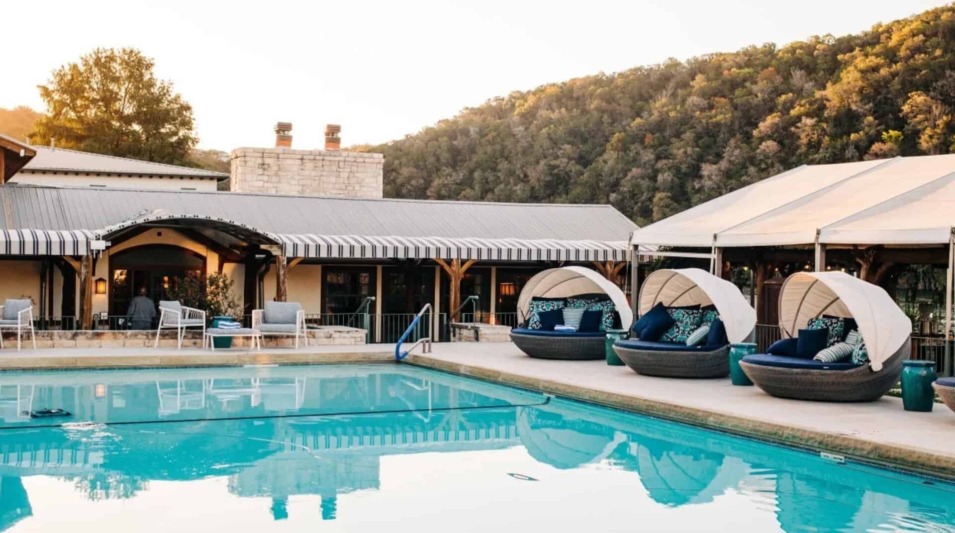 Lakeside resort pool with cabanas at Lake Austin Spa Resort in Austin, Texas