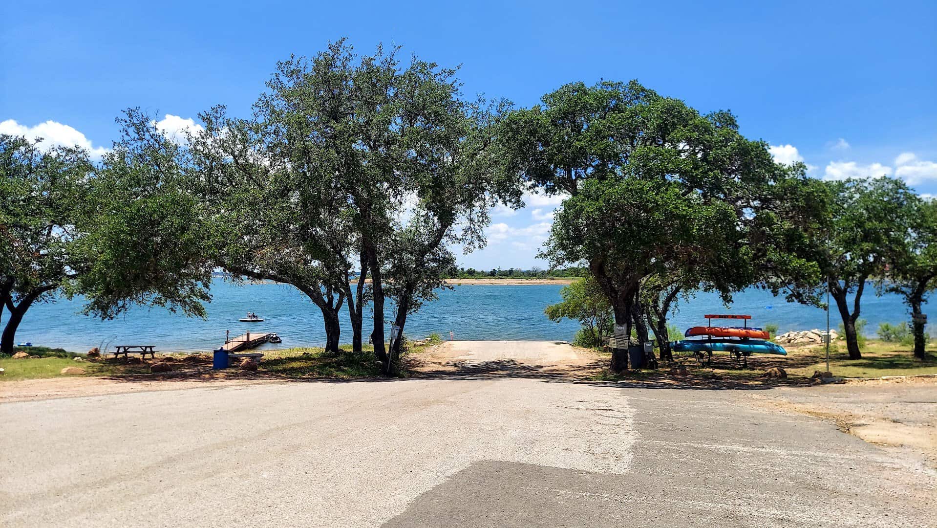 Tree-lined beach and shoreline along Lake Buchanan in Burnet, Texas