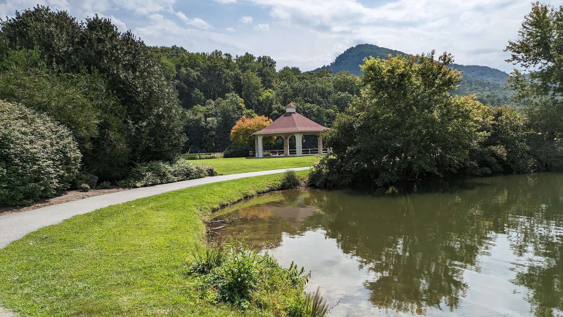 Lakefront pavilion and Chimney Rock at Lake Lure, North Carolina