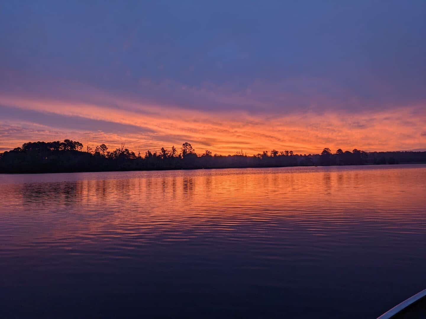 Sunset over the calm water of Lake O' the Pines in East Texas