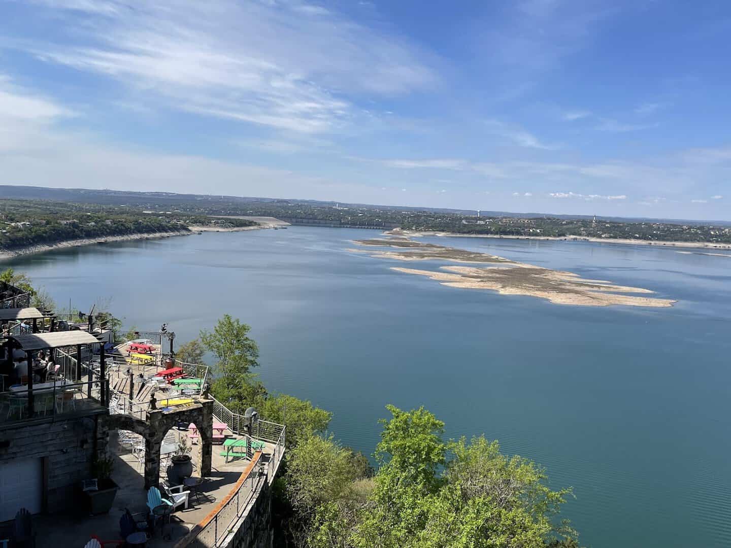 Lake Travis winding between wooded limestone shoreline in Central Texas