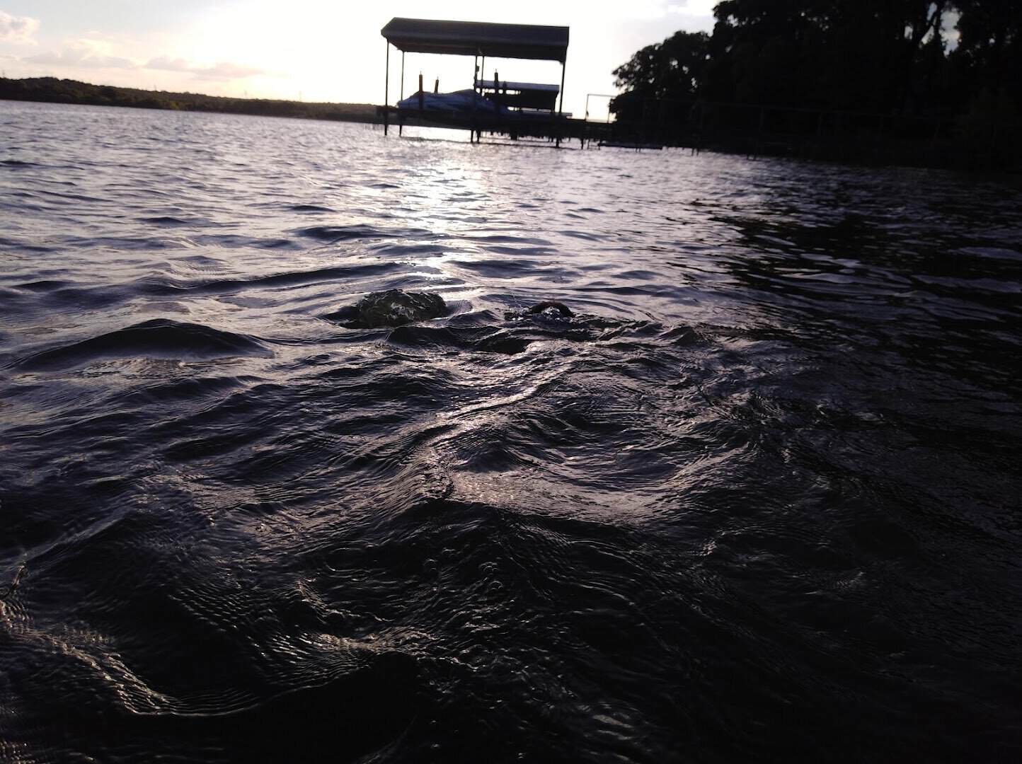 A dock reaching out over the open water at Lake Weatherford, Weatherford Texas
