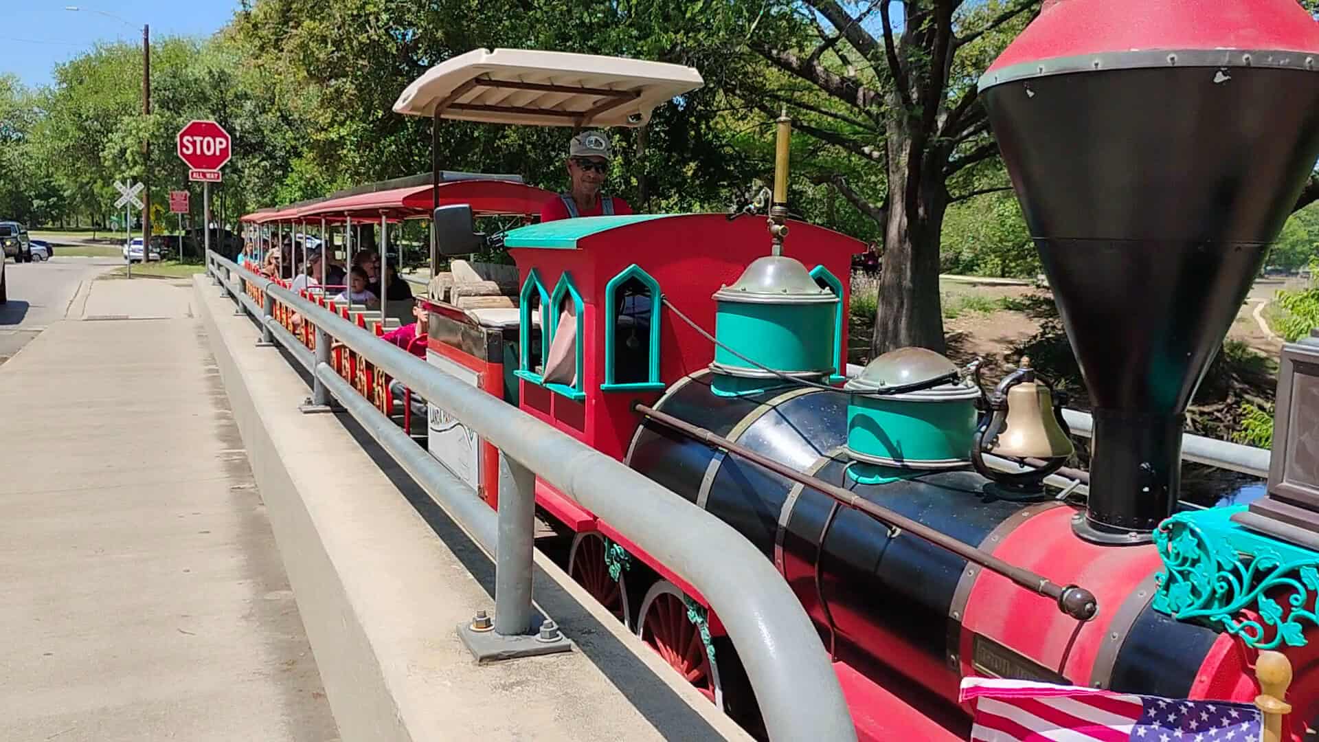 The Landa Park miniature train carrying riders along its loop through New Braunfels, Texas
