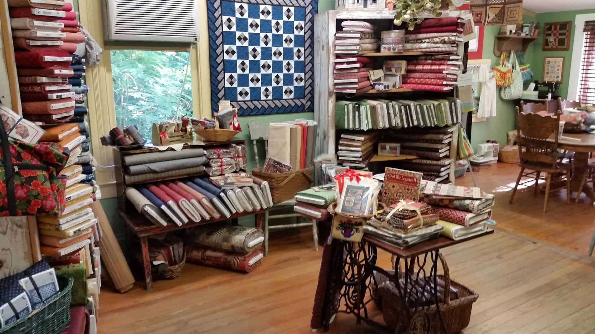 Room of fabric bolts on shelves inside Las Colchas in San Antonio