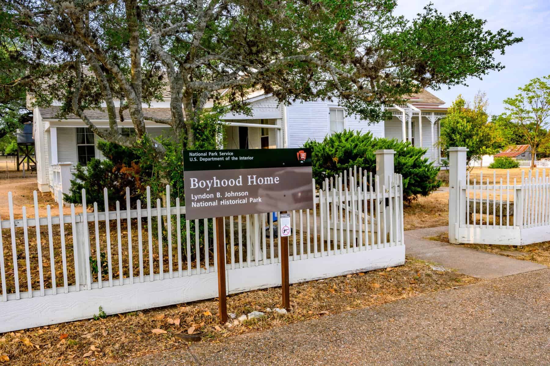 The Lyndon B. Johnson Boyhood Home sign and house in Johnson City, Texas