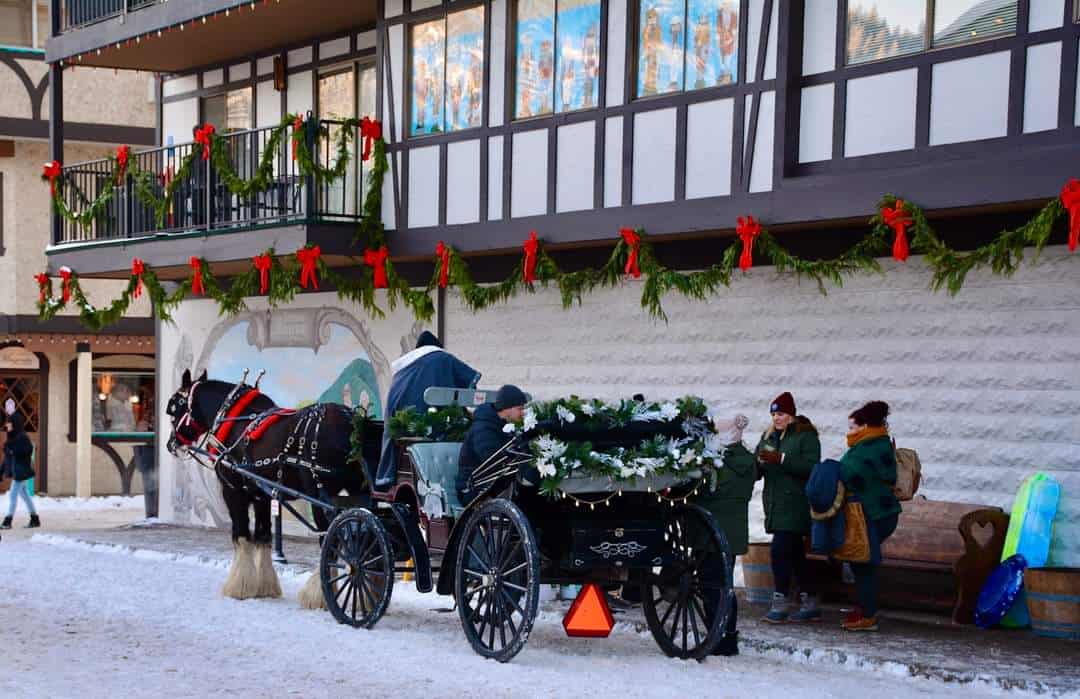 Snowy Bavarian village street with a horse carriage in Leavenworth, Washington