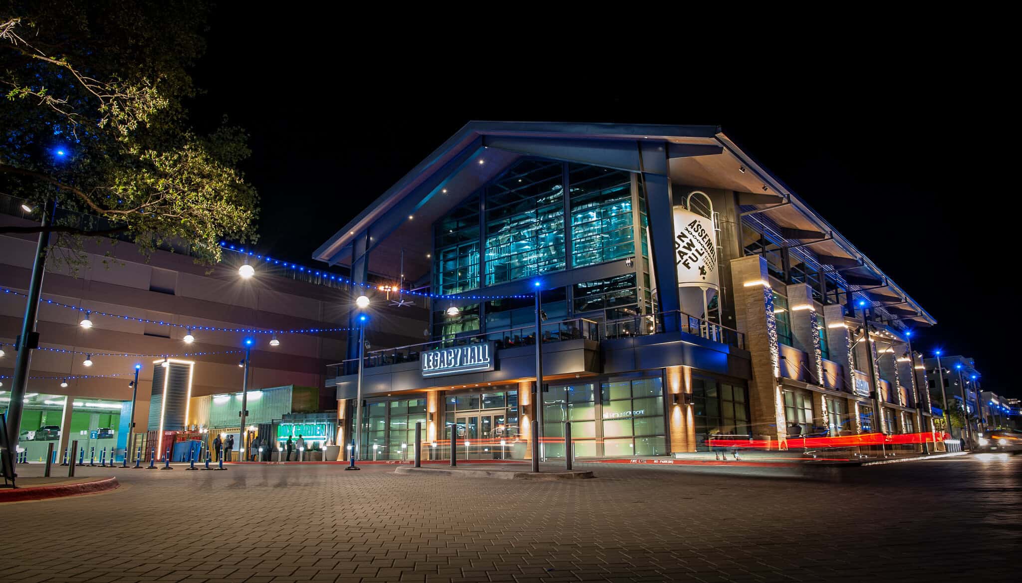 Legacy Food Hall lit up at night in Plano, Texas