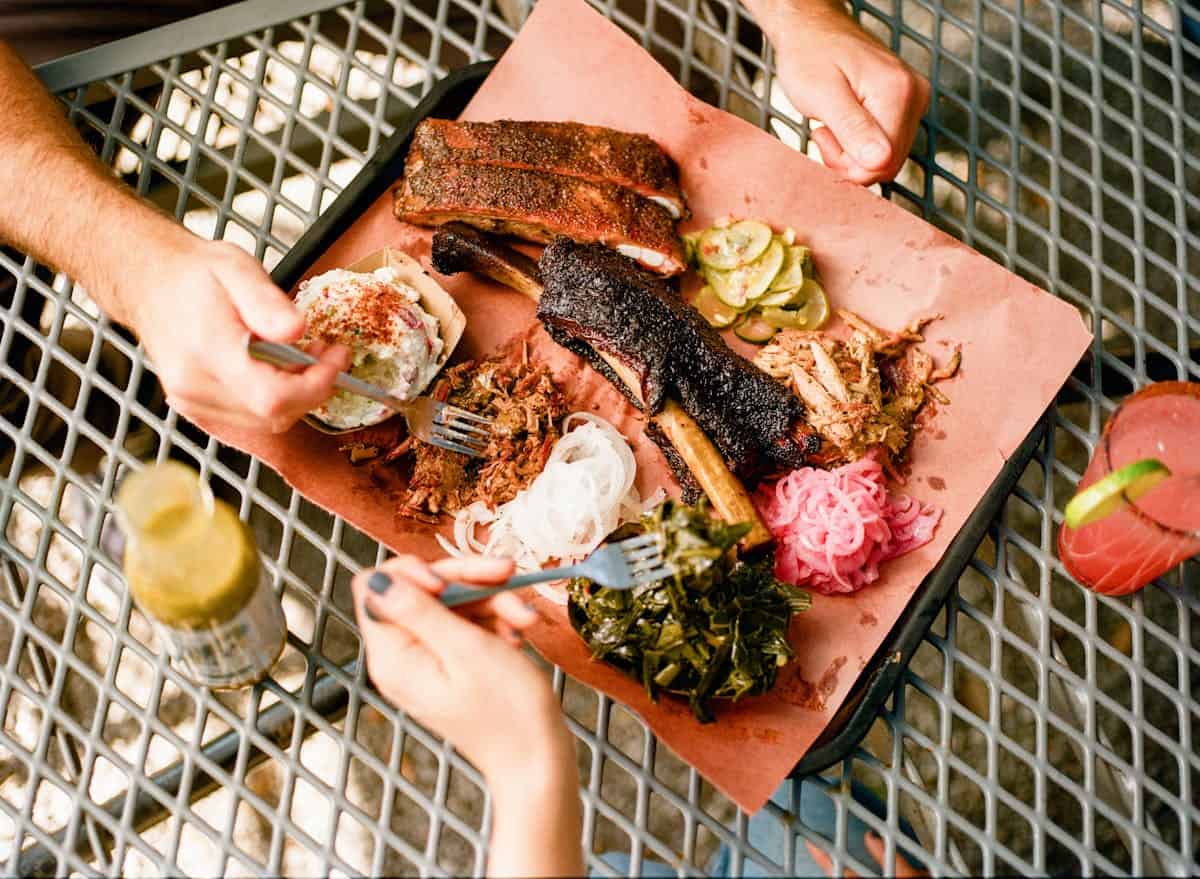 Overhead tray of brisket and sides at Lewis Barbecue in Charleston, South Carolina