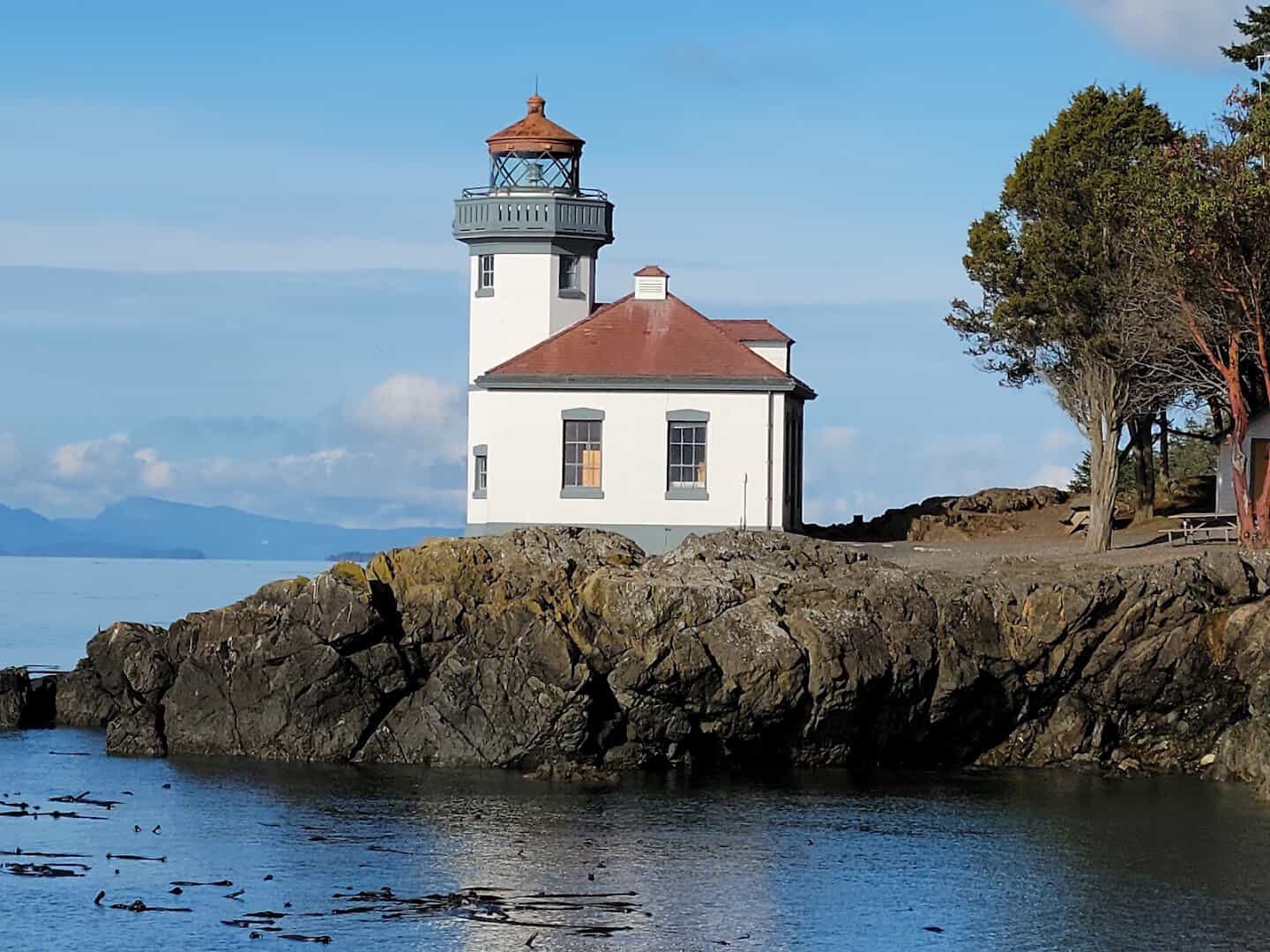 Lime Kiln Point lighthouse on the rocky shore of San Juan Island, Washington, a shore-based orca watching spot