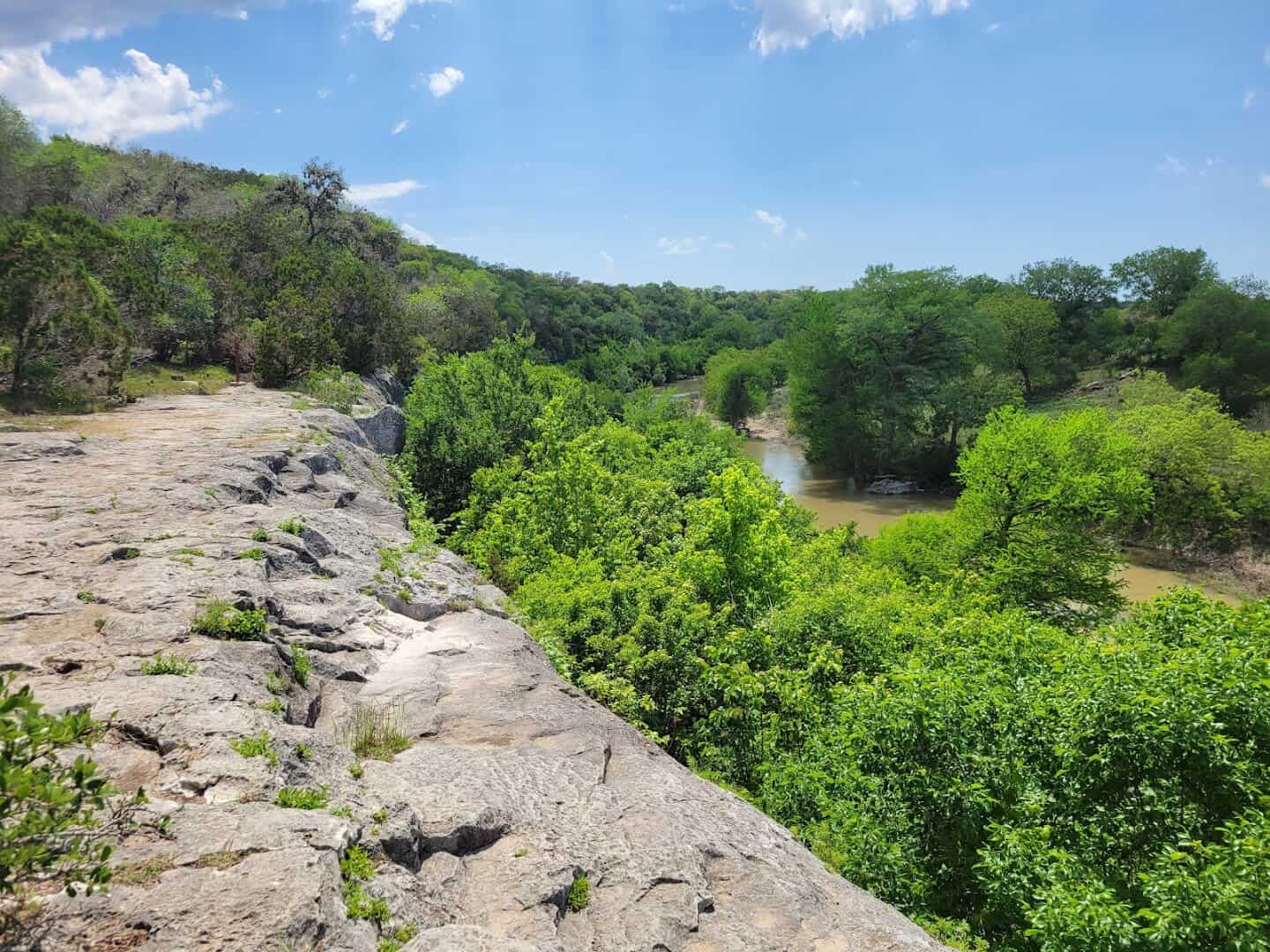 Limestone canyon ledges above the green river at Guadalupe River State Park, Texas