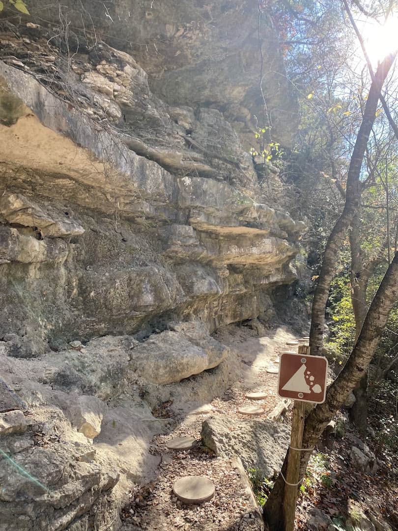 Limestone canyon wall beside the trail at River Place Nature Trail in Austin, Texas